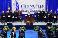 Glenville State University Associate Provost Dr. Mari Clements (at podium) recognizes members of the platform party during the commencement ceremony on Saturday, May 6. (GSU Photo/Sam Santilli)