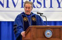 Glenville State University President Dr. Mark A. Manchin at the podium during a previous Commencement Ceremony. Manchin will confer degrees upon graduates at the end of this semester on Saturday, December 10 at Glenville State’s Waco Center. (GSU Photo/Kristen Cosner)