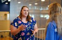 Stormie Alverson (left) speaks to a new student about a campus club during the Glenville State University Community and Campus Organization Fair in 2021. (GSU Photo/Kristen Cosner)
