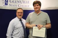 Faculty Award of Excellence recipient Dr. Jeremy Keene (right) with Provost Dr. Victor Vega