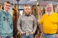 (l-r) Evan Jedamski, Jacob Petry, and Tom Snyder at the WV Trappers Association Fur Auction.