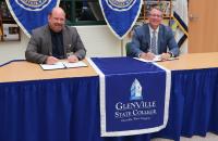 Braxton County Schools Superintendent David Dilly and Glenville State College President Dr. Tracy Pellett at the signing ceremony