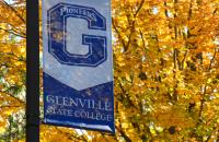 A banner on the campus of Glenville State College with a backdrop of autumn leaves. (GSC Photo/Kristen Cosner)