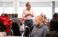 Glenville State University President Dr. Mark Manchin (standing) shares his thoughts on the season with faculty and staff members gathered at the Holiday Luncheon. (GSU Photo/Kristen Cosner)