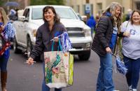 Returning Glenville State cheerleaders toss candy to attendees as they make their way down the parade route during the 2021 Homecoming festivities. (GSU Photo/Kristen Cosner)