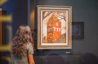 A student views artwork in the Jim Rogers Retrospective Art Exhibit that is currently on display at Glenville State College. (GSC Photo/Kristen Cosner)