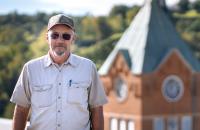 Glenville State University Trades Specialist Jim Tatman with the historic Administration Building Clock Tower behind him. (GSU Photo/Kristen Cosner)