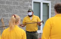 WVDOF Forester Jesse King (center) reviews different types of wildfire fighting hand tools with GSC students (GSC Photo/Kristen Cosner)