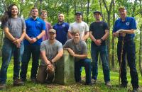 Glenville State University students and faculty members at the “terminal point” of the Mason-Dixon line. The group includes (l-r) Gabe Soto, Billy Harkins, John Kolodziej, Abe Stearns, Jacob Petry, Jack Hadley, Jacob Hoyt, Bryan Utt, and Rick Sypolt. (Courtesy photo)