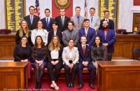 Glenville State College student Fairan Gill (second from left, middle row) poses for a group photo alongside the other Frasure-Singleton Interns inside the West Virginia House Chamber | WV Legislative Photography Photo by Will Price