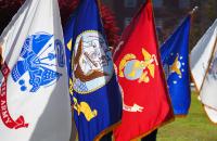 Various flags from branches of the U.S. Armed Forces on display at a past Glenville State University event. A Military Appreciation Ball is being planned by Glenville State’s Student Veterans Association for April 15. (GSU Photo/Kristen Cosner)