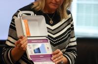 Susie Mullens, Director of the West Virginia Collegiate Recovery Program, holds a ONEbox Naloxone kit during a training session with students at Glenville State University. (GSU Photo/Dustin Crutchfield)