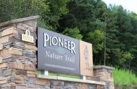 A three-dimensional sign, donated by Don and Glendora Hedley, marks the beginning of the Pioneer Nature Trail