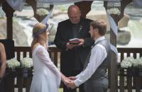 Fred Walborn (center) officiates the wedding of Joanna Lamp and Jackson Ranhart on August 5