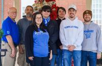 (l-r) Dennis Fitzpatrick, Dave Kennedy, Hannah Rexroad, Garrett Watts, Cody Dye, Nic McVaney, and Conner Ferguson recently spent time hanging Christmas decorations in Downtown Glenville. (GSC Photo/Kristen Cosner)