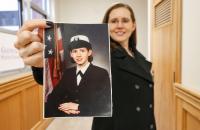 Glenville State College student veteran Sabrina Gonzalez holds a service-era photo of herself (GSC Photo/Kristen Cosner)