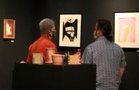 Department of Language and Literature faculty members Dr. Marjorie Stewart (left) and Dr. Jonathan Minton browse Trillium Art Show entries during the 2021 show. The 2022 show will be on display February 1-11 with an opening reception on Friday, February 4.