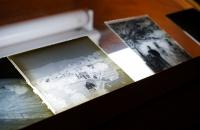 Several glass negatives, which were donated to the Glenville State College Archives, are displayed on a light box. (GSC Photo/Kristen Cosner)