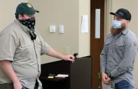 Glenville State College graduate and current WV Division of Natural Resources Wildlife Manager Mitch Queen (left) chats with Jacob Petry during his recent visit to GSC.